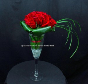 Champagne Tastes: one dozen premium roses arranged in an oversized champagne glass.