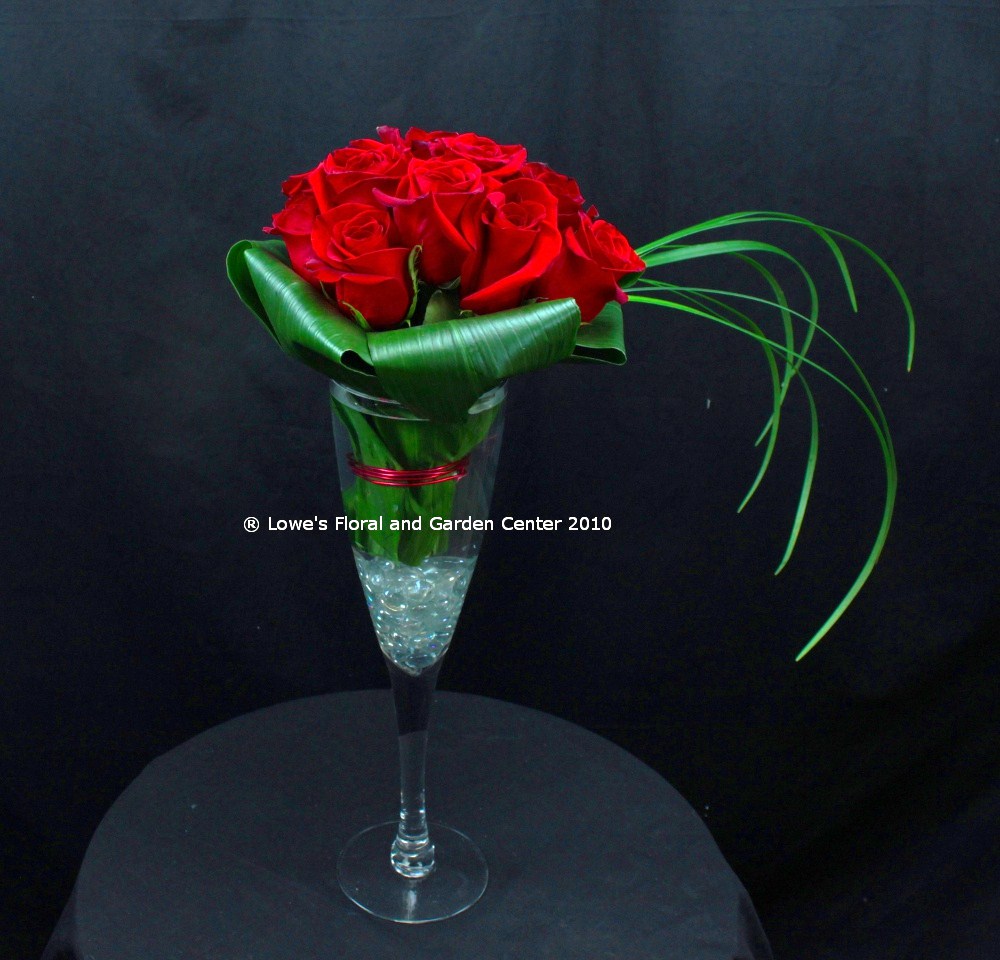 Premium Ecuadorian Roses arranged in a unique clear glass champagne flute.